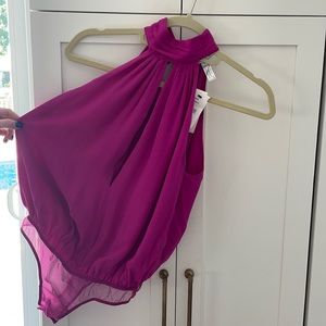 Magenta open back silk/nylon bodysuit. Semi open front